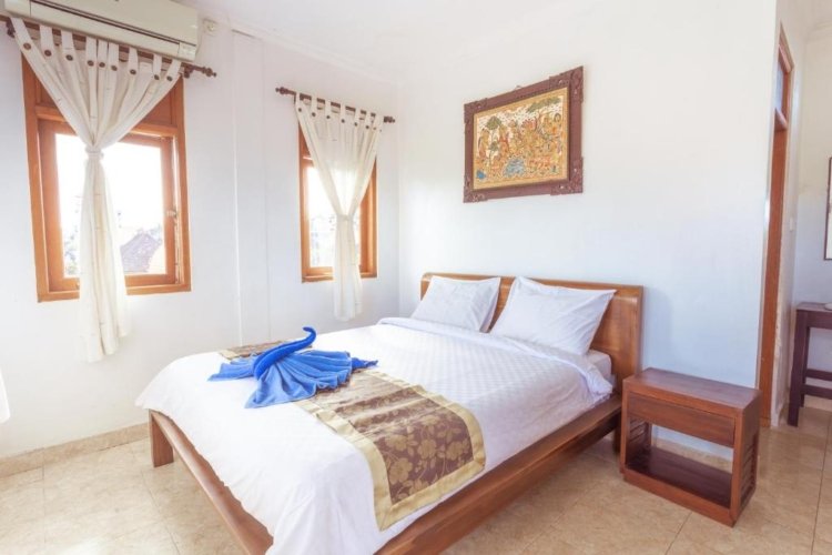 Comfortable Deluxe Room bedroom in Ubud Homestay