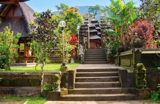 Traditional stone steps leading to the main prayer area of the ancient Pura Luhur Batukaru temple complex.