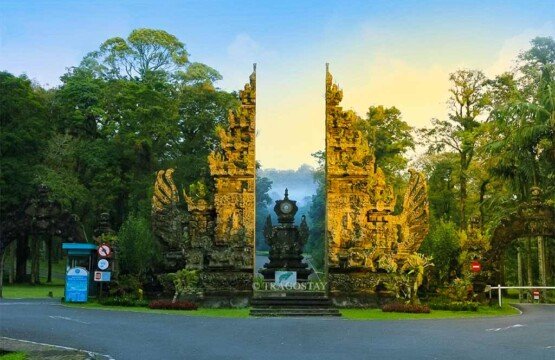 Iconic Balinese entrance gate of Bali Botanical Garden featuring traditional stone carvings.