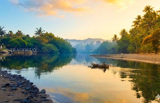 Scenic panorama where the Balian River meets the sea at Balian Beach.