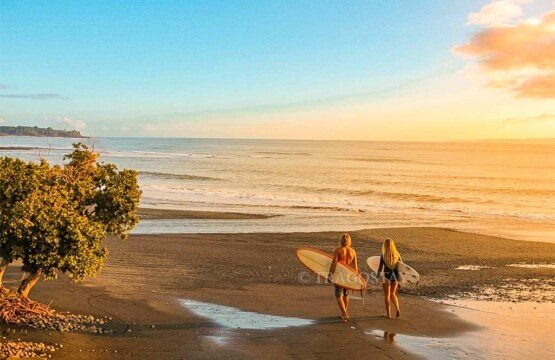 A surfer riding a powerful wave, showcasing great surf experiences at Balian Beach.