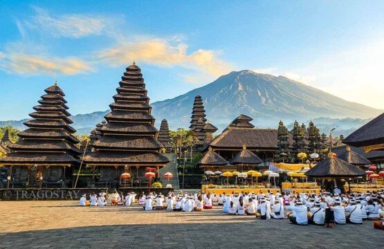 The bustling main area of Besakih Temple featuring numerous tiered Meru towers and shrines.