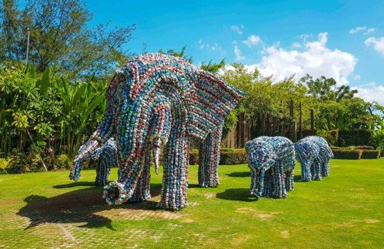 Majestic stone elephant statues standing among tropical plants at Big Garden Corner Sanur.