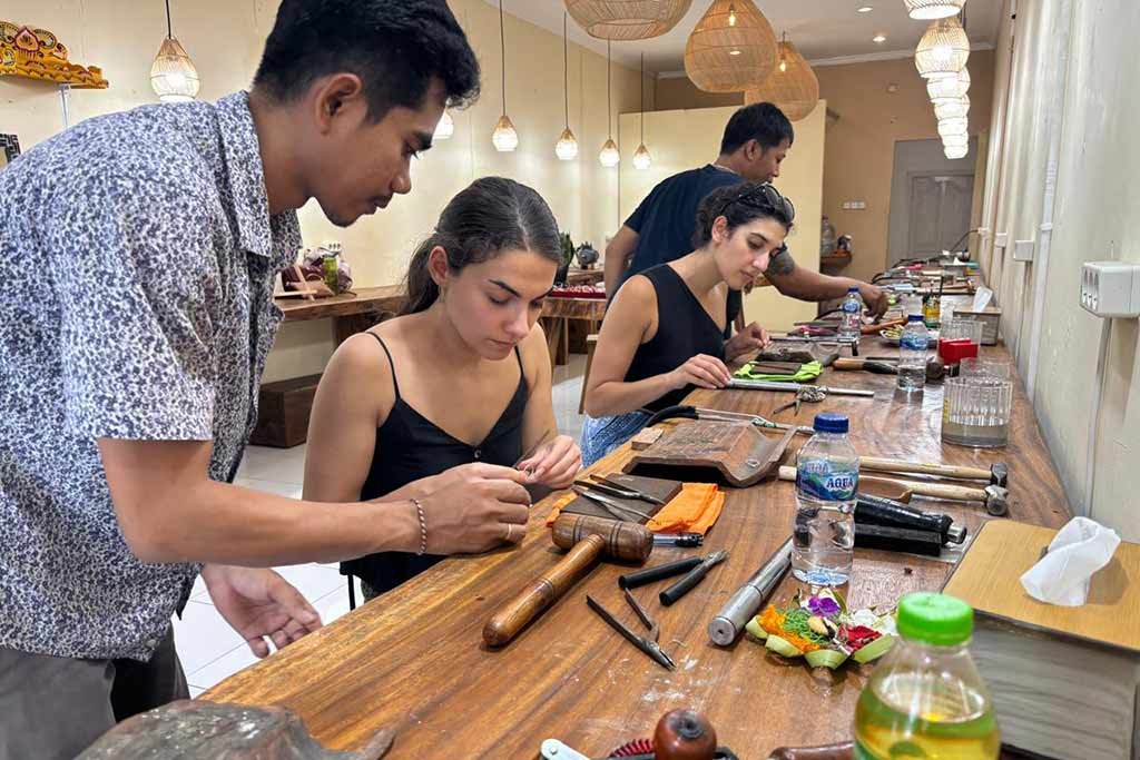 International tourists enjoy joining a hands-on silver jewelry making class at Celuk Village.