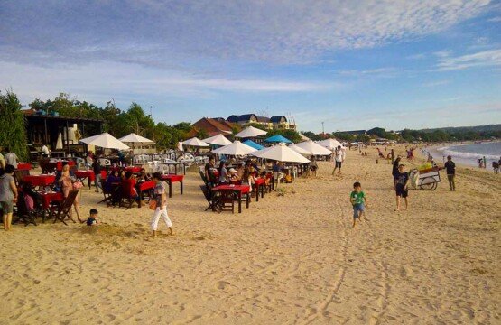 Jimbaran Beach seafood cafe setup on the sand at popular Bali tourist destinations.