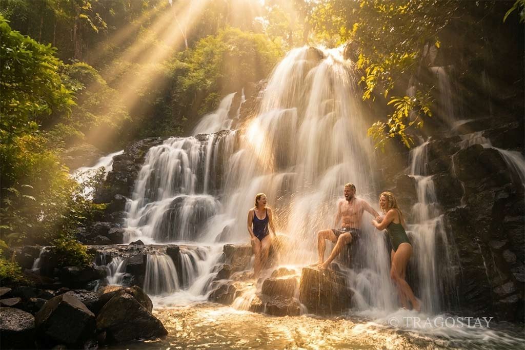 Tourists enjoying a fresh bathing experience at Kanto Lampo Waterfall.