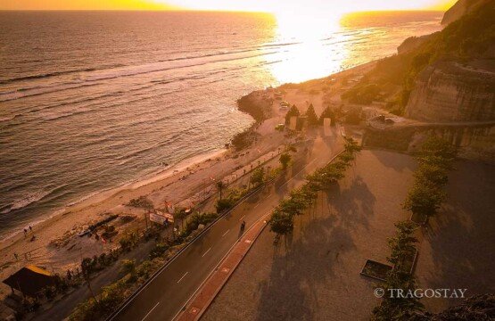 Famous sunset view at Melasti Beach Bali tourist attractions from the shoreline.