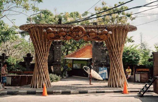 Organized Padang-padang Beach parking area for cars and motorcycles in Uluwatu.