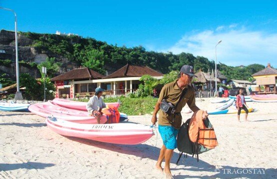 Local canoe services at Pandawa Beach Bali tourist attractions providing life jackets and gear.