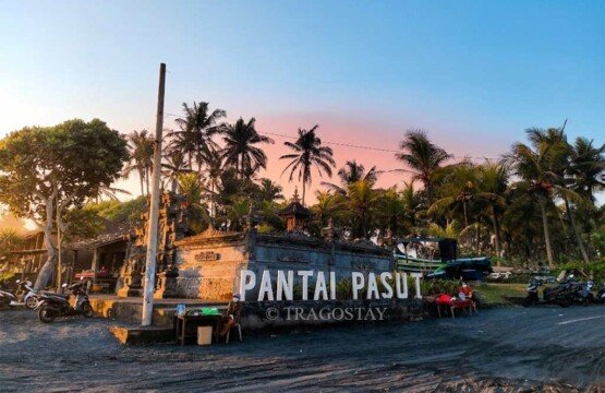 A peaceful Balinese Hindu temple (Pura) located on the shore of Pasut Beach during the afternoon.