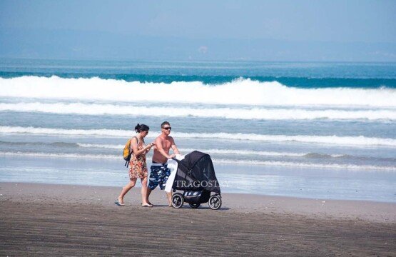 Seminyak Beach as one of the best family trip destinations in Bali for children and parents.