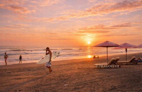 Favorite Bali tourist attractions Seminyak Beach sunset with colorful sky.