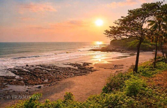 Soka Beach blessed by a spectacular sunset with vibrant orange and purple skies.