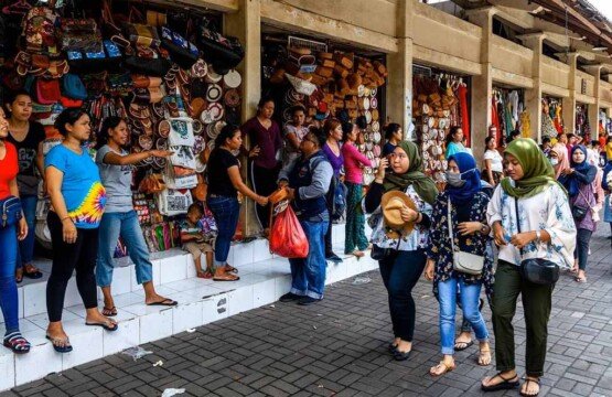 Domestic travelers visit Sukawati Art Market in Gianyar Bali for authentic souvenirs.
