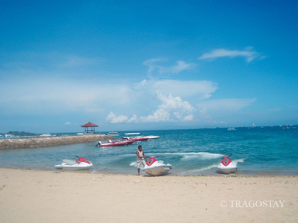 ourists enjoying a Tanjung Benoa Beach jet ski ride at the famous Bali water sport center.
