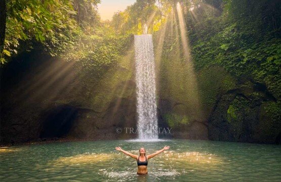 The safe and relaxing Tibumana Waterfall swimming experience, a popular Bali tourist attraction.