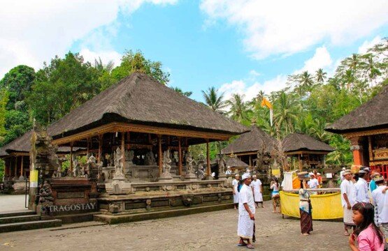 The peaceful inside area of Tirta Empul Temple Tampak Siring with traditional pavilions.