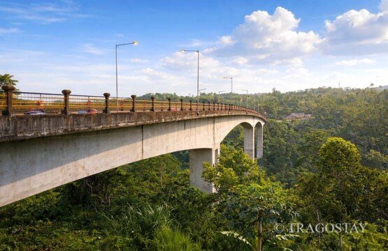 Tukad Bangkung Bridge surrounded by tropical forest and lush green valleys in Pelaga.