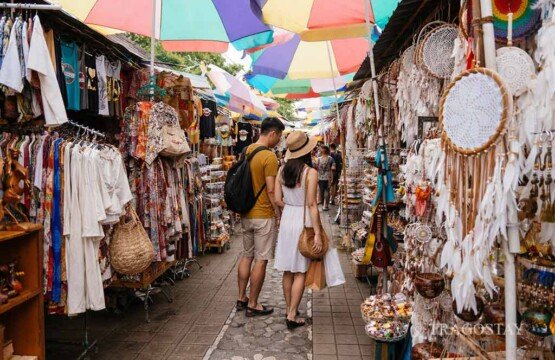 Travelers shopping around at Ubud Art Market, a must-see among Bali places to visit.
