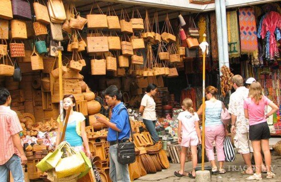 Traditional rattan and ata bag shopping at Ubud Art Market, a popular Bali tourist attraction.