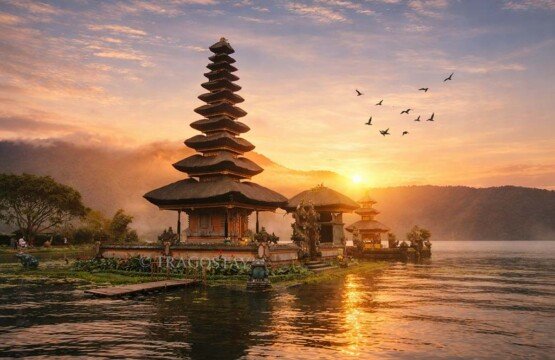 Spectacular sunrise at Ulun Danu Beratan Temple Bedugul with a golden sky.