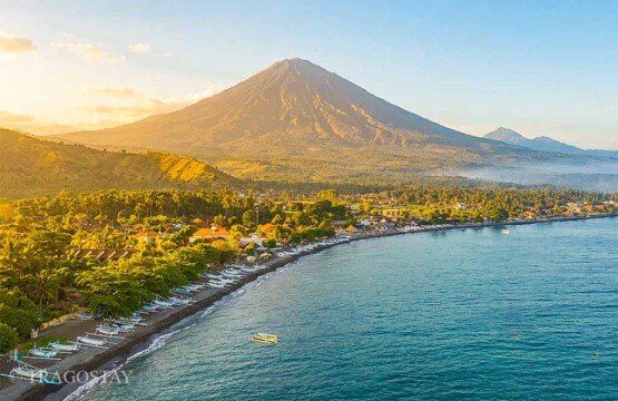 An afternoon panoramic overview of Amed Beach coastline featuring the magnificent Mount Agung.