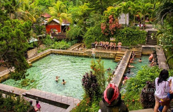 A beautiful high-angle overview of the tiered hot spring pools at Banjar Hot Springs, serving as a prime travel destination in North Bali.