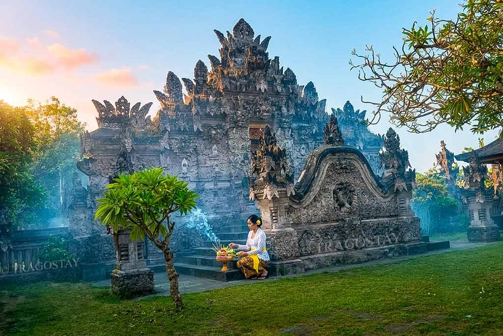 The iconic ancient shrines of Beji Temple hand-carved entirely from local pink volcanic sandstone (batu padas) in Sangsit Village.