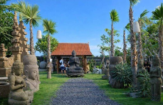 Detailed stone statues and Balinese sculptures at Big Garden Corner, one of the top Bali tourist destinations.