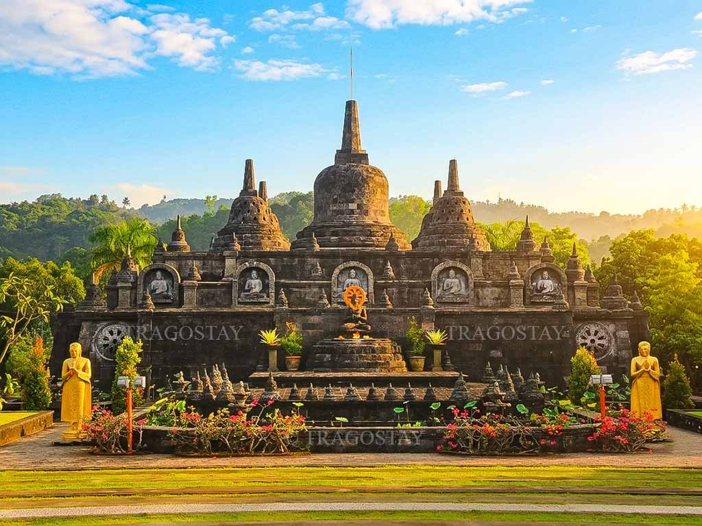 The iconic bell-shaped stone stupas of the miniature Borobudur replica under a clear sky at Brahmavihara Arama.