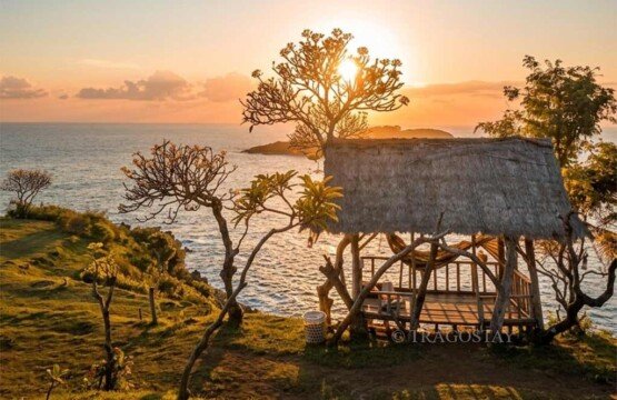 A traditional bamboo hut at Bukit Asah perfectly positioned for a spectacular sunset view.