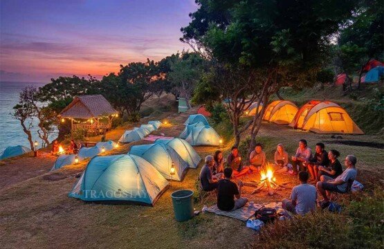 A cozy campfire at the Bukit Asah camping ground overlooking the dark blue ocean at night.