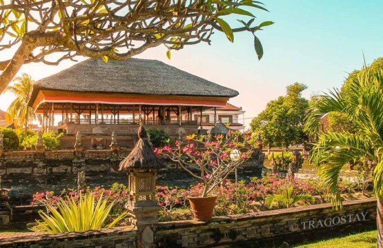The grand architecture of Bale Kambang at Kerta Gosa glowing in the soft light of a clear morning.