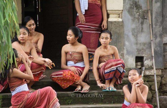 Local Tenganan girls wearing traditional Geringsing woven fabrics during a village ceremony.
