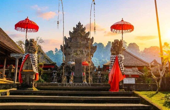 A beautiful front perspective of Pura Penataran temple at Penglipuran Village illuminated by clear morning sunlight.