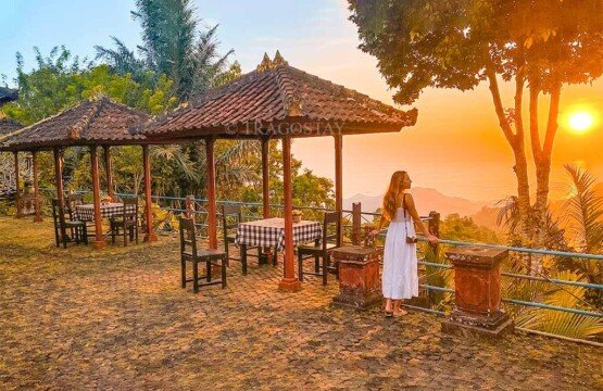 A traveler sitting peacefully while soaking in the romantic and quiet sunset vibes at Putung Hill.