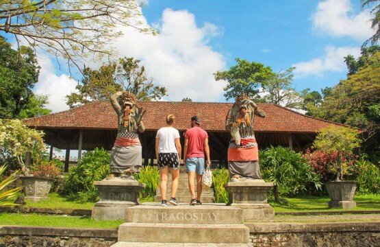 A long traditional Balinese Bale pavilion overlooking the water gardens at Tirta Gangga Water Palace.